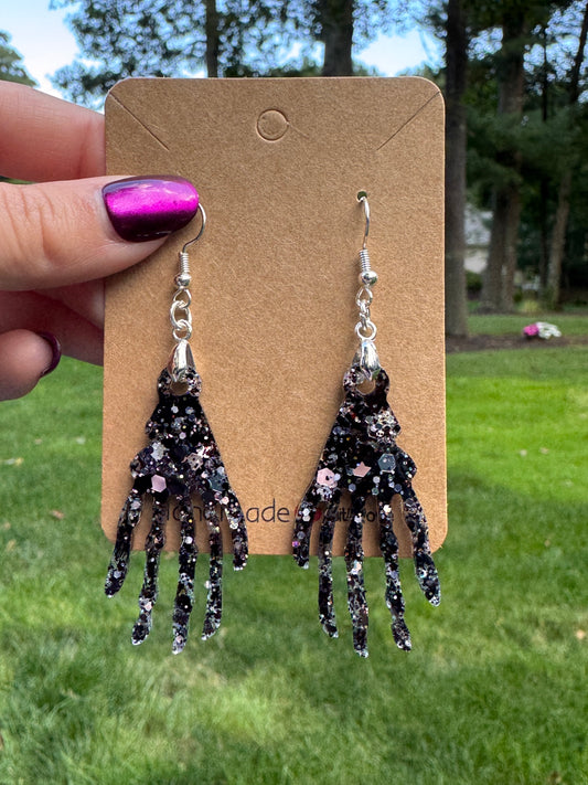 Black sparkly skeleton hand